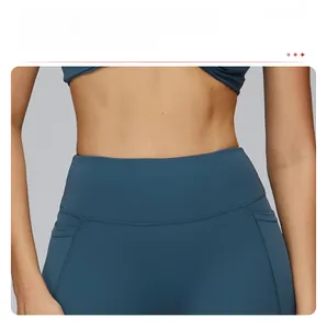 Detail of high-waisted yoga leggings with wide waistband for tummy control and support