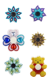 Close-up of 6 DIY diamond painting fidget spinner accessories with colorful crystal rhinestones