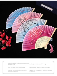 Detail of floral folding fans with cherry blossom patterns and elegant tassels