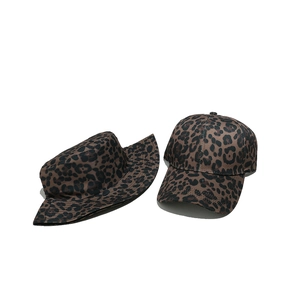 Detailed view of leopard print sun hats featuring both bucket and baseball cap styles