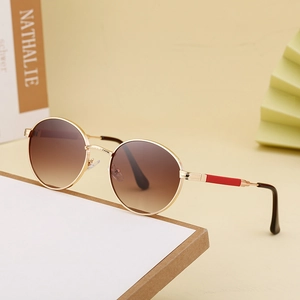 Vintage round frame sunglasses with gold metal rims and brown gradient lenses for women
