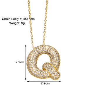 Detail of gold letter Q pendant necklace with white zircons and size specifications