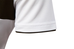Detail of white piqué cotton polo sleeve with brown trim and reinforced stitching