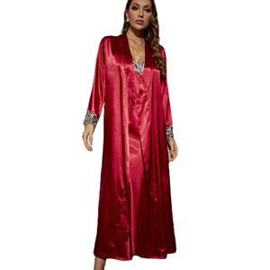 Women's ruby red satin sleepwear set with long robe, lace trim, and slip dress