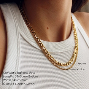 Double-layered golden stainless steel necklace with Figaro chain for a layered fashion look