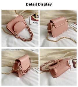 Detail view of pink mini jelly bag featuring dual chains and magnetic flap closure