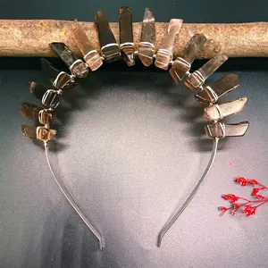 Macro detail of smoky quartz crystal headpiece with silver wire hand-wrapped on a headband