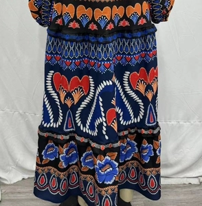 Detailed pattern of bohemian print maxi dress in navy blue with ethnic floral motifs