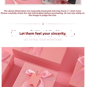 Detailed view of pink gift box with silk bow ribbon and customized hanging tag decoration