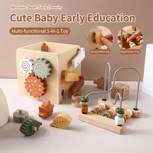 Macro view of 5-in-1 wooden busy cube showing colorful gears and shape sorting details