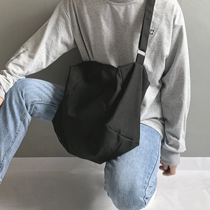 Minimalist black large capacity canvas crossbody bag for students in street style