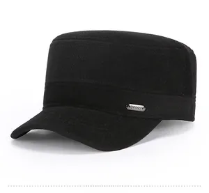 Detail of winter wool flat top cap with metal logo plate and thick warm texture