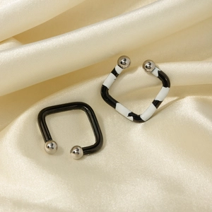 Square zebra pattern ear cuffs with silver beads on a premium gold silk background