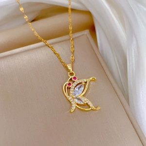 Elegant gold titanium butterfly necklace with sparkling zircon and red gemstones details
