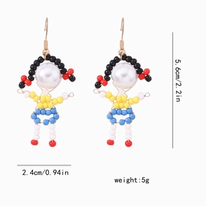 Detailed size view of cartoon beaded earrings with white pearl head and gold hooks