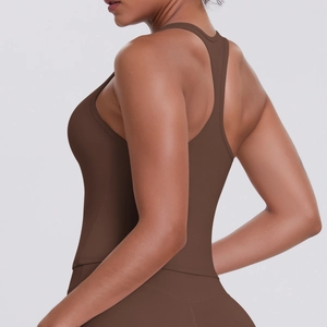 Detail view of the stitching and racerback design on a brown athletic yoga vest