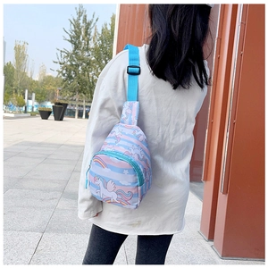 Outdoor shot showing kids unicorn chest bag with pink and blue stripes for daily use