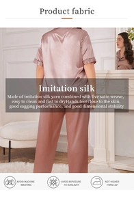 Detail view of pink imitation silk pajamas set showing smooth satin texture and drape