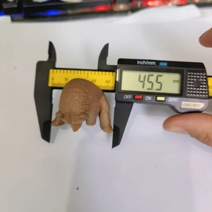 Detailed measurement of the 45.5 mm small brown bear figurine using a digital caliper