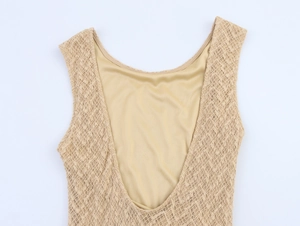 Detail of beige sleeveless knit dress showing lace hollow texture and smooth lining