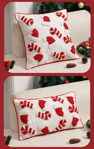 Detail der weihnachtlichen Kissenhülle mit Tufting-Motiven und roter Paspelierung