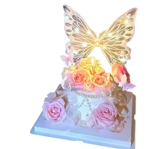 Iridescent embroidery butterfly cake topper with faux pearls and pink roses decoration