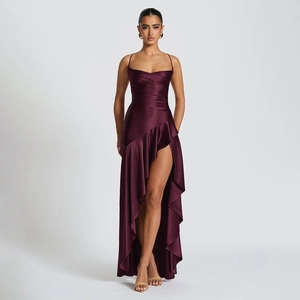 Detailed view of dark purple satin dress featuring elegant ruffles and high slit design
