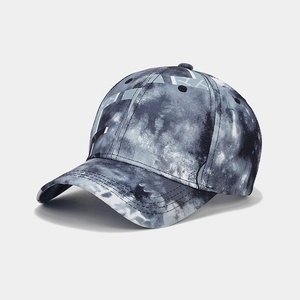 Detail of baseball cap showing marble digital print texture and reinforced brim stitching