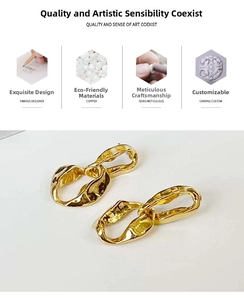 Detailed macro view of gold-colored copper earrings with artistic irregular twisted textures