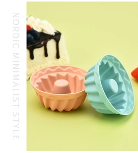 Pink and blue silicone bundt cake molds in a minimalist Nordic style kitchen setting