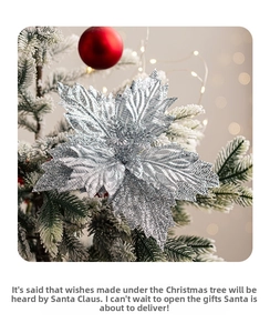 Macro shot of silver glitter poinsettia flower on snow-covered Christmas tree with bokeh