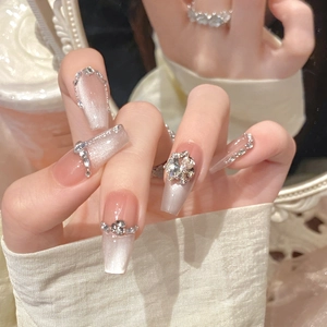 Luxury cat-eye press-on nails in nude pink gradient with diamonds and rhinestones