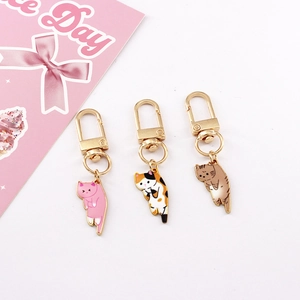 Three cute alloy cat keychains with pink and tabby patterns and golden lobster clasps