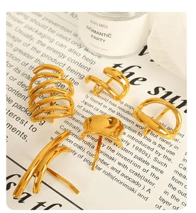 Detailed view of 5-piece minimalist gold titanium steel hair clips set on aesthetic background