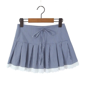 Detail of blue plaid mini skirt with bow tie waist and delicate white lace hem trim