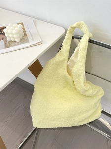 Minimalist light yellow bubble fabric tote bag with spacious interior for casual style