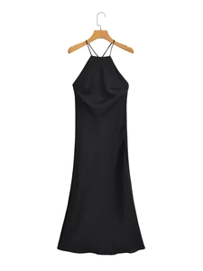 Close-up of the elegant black satin fabric and backless halter design on long dress