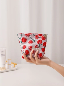 Chic cherry print makeup pouch in light grey fabric with elegant gold flower zipper