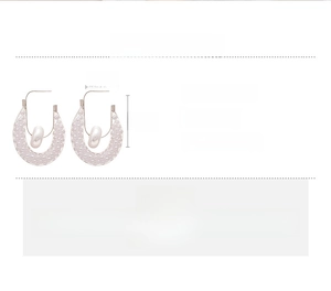 Detailed view of hollow mesh U-shaped earrings with faux pearl, copper material details