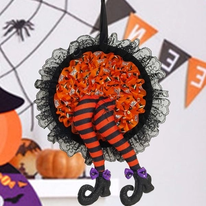 Halloween witch leg wreath with orange spider pattern and striped legs for party decor