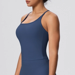 Detail of navy blue high-stretch yoga tank top with thin straps and racerback design