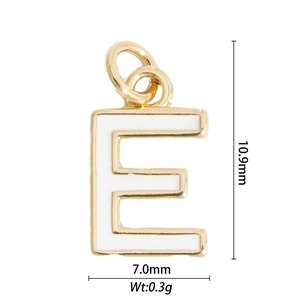 Macro shot of letter E gold pendant with white enamel detailing and size measurements