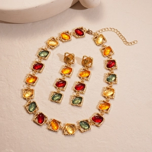 Retro resin necklace and earrings set with colorful oval stones in gold square frames