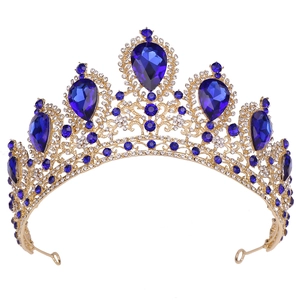 Elegant gold bridal crown with blue teardrop gemstones and clear crystal accents