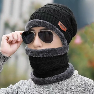 Close-up of thick fleece lining and knit texture on men's winter hat and neck warmer set