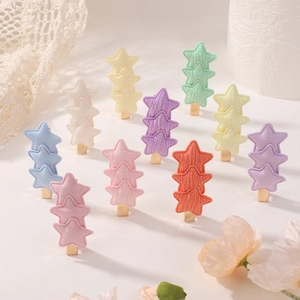 Set of colorful star hair clips for girls featuring layered fabric star designs