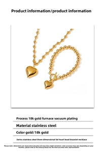 Detail view of 18K gold plated stainless steel bead necklace and heart pendant set