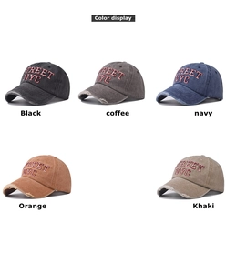 Close-up of distressed cotton baseball caps with 3D embroidery in multiple vintage colors