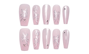 Detail of pink cat-eye press-on nails with silver butterfly patterns and small rhinestones