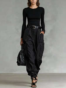 Minimalist black knit top and high-waisted cargo pants with multi-pockets outfit set